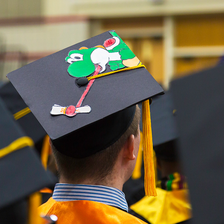 Yoshi grabbing a diploma